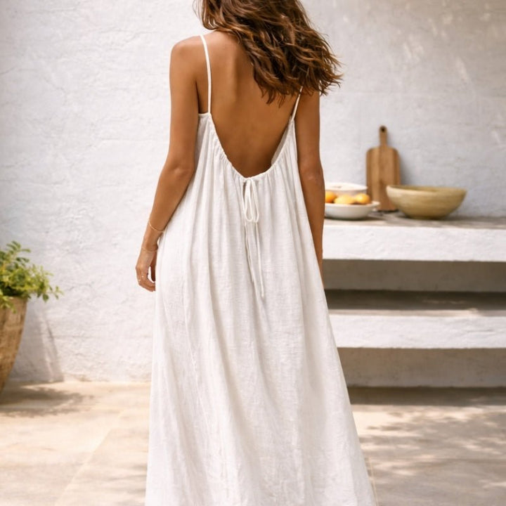 Robe d'été maxi fluide bohème pour femme, avec bretelles fines, dos nu et poches. Idéale vacances.