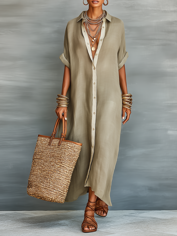 Femme en robe chemise longue oversize décontractée. Look estival parfait, manches courtes et col chemisier.
