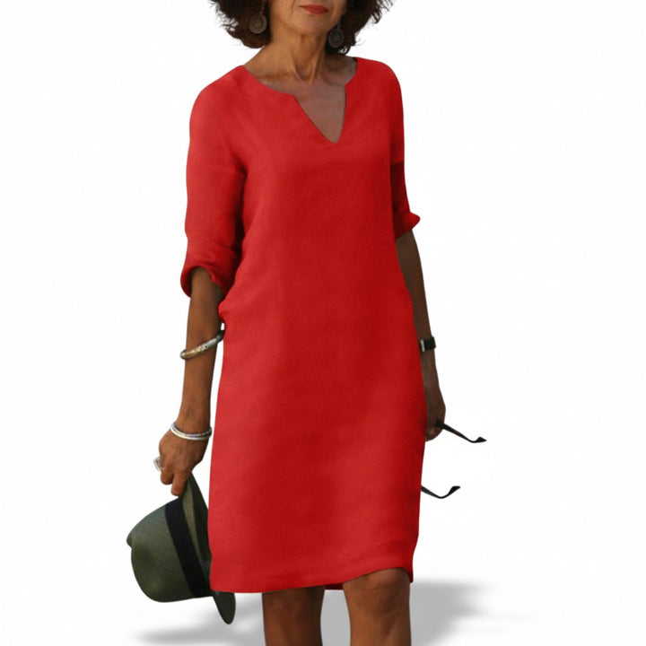 Robe midi ample femme noire, col V, manches 3/4. Élégance décontractée printemps-été.