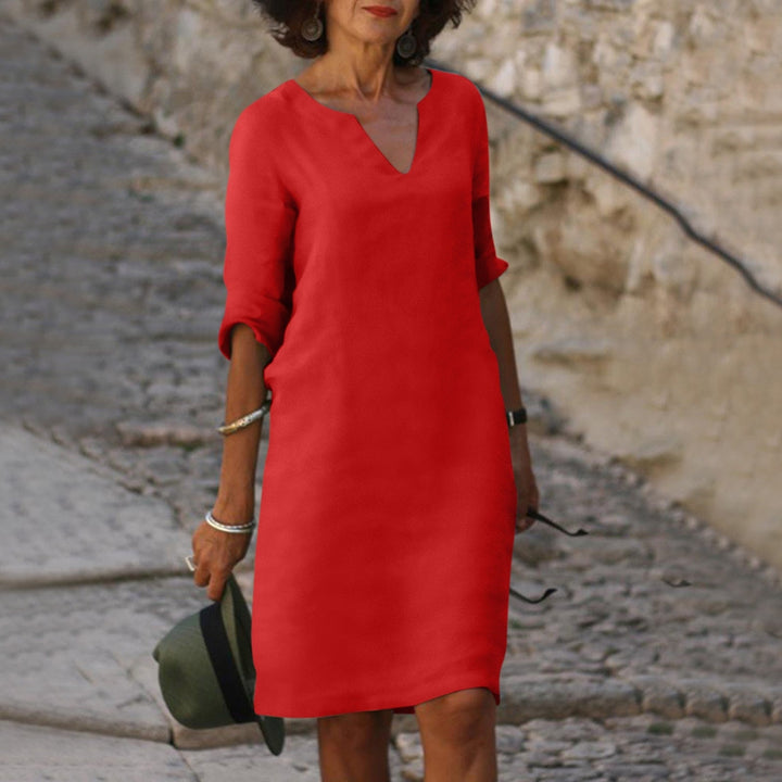 Élégante robe midi ample femme décontractée, col en V, manches trois-quarts. Parfaite pour le quotidien.