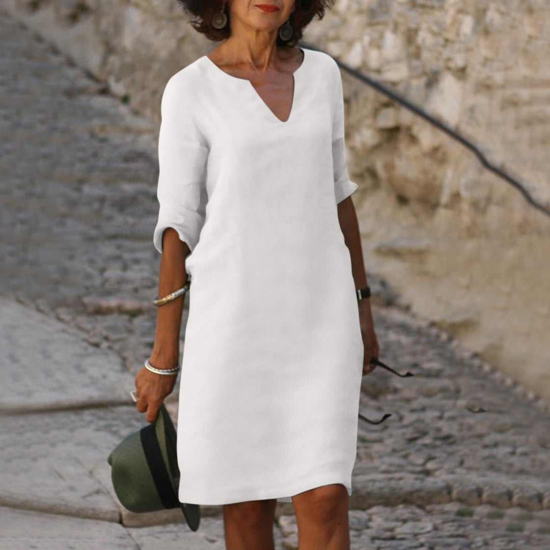 Look quotidien avec robe midi ample femme, col V et manches trois-quarts. Confort et élégance.