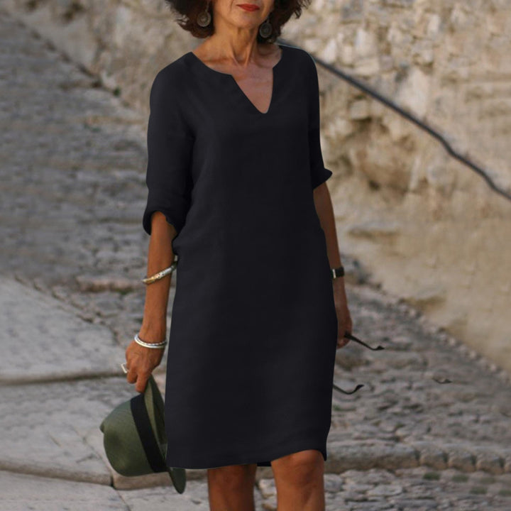 Robe décontractée chic femme, coupe ample midi. Manches 3/4 et col V. Printemps-été parfait.