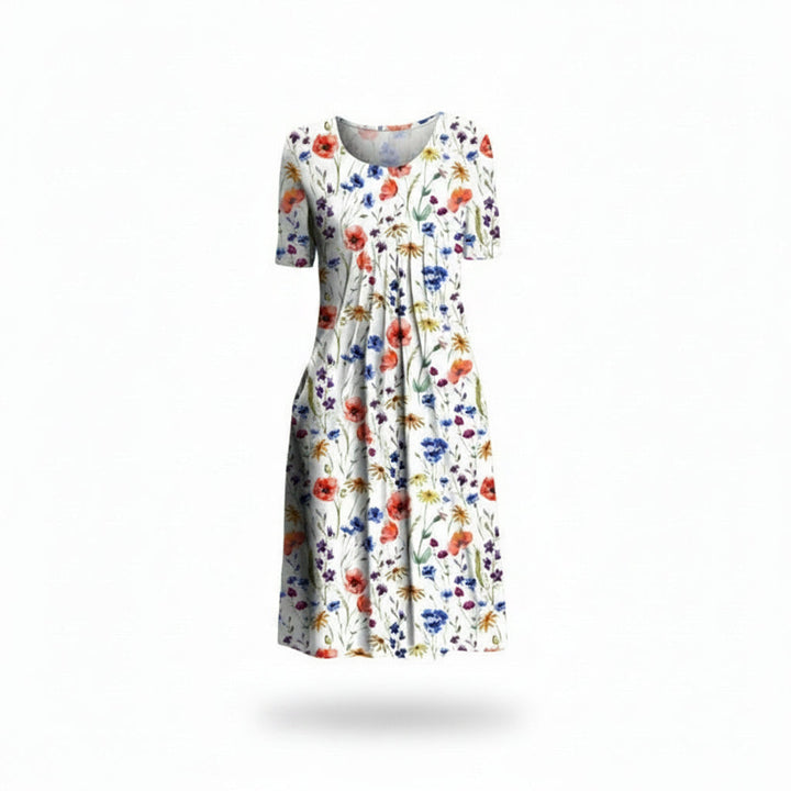 Robe midi fleurie femme, col rond, manches courtes, poches latérales. Style décontracté et fluide pour l'été.