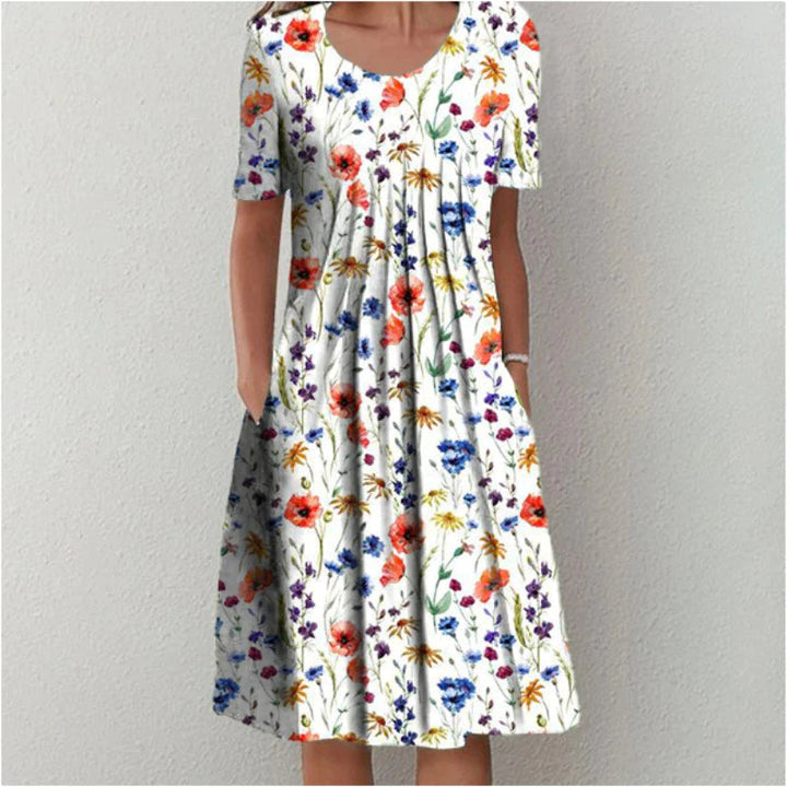 Robe midi décontractée et élégante, motif fleuri, idéale pour printemps/été. Tissu fluide pour femme.