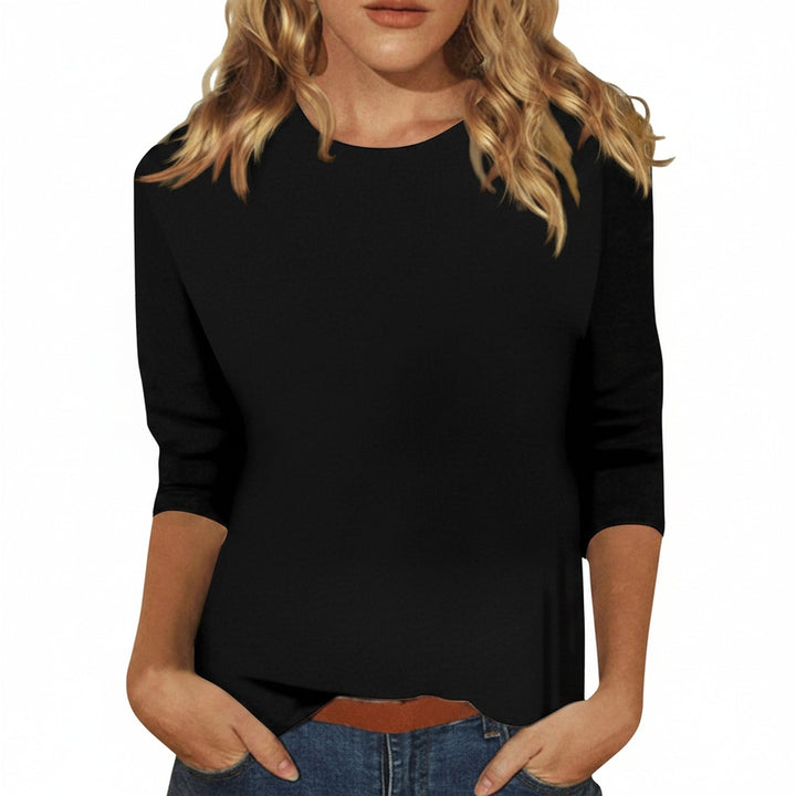 T-shirt femme élégant manches trois-quarts, col rond. Idéal pour un look casual chic ou bureau. Mode femme.