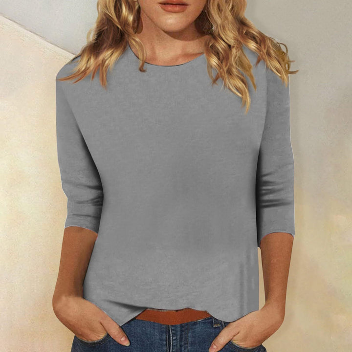 Mode femme: T-shirt à manches trois-quarts, col rond. Élégant et confortable pour le bureau ou le quotidien.