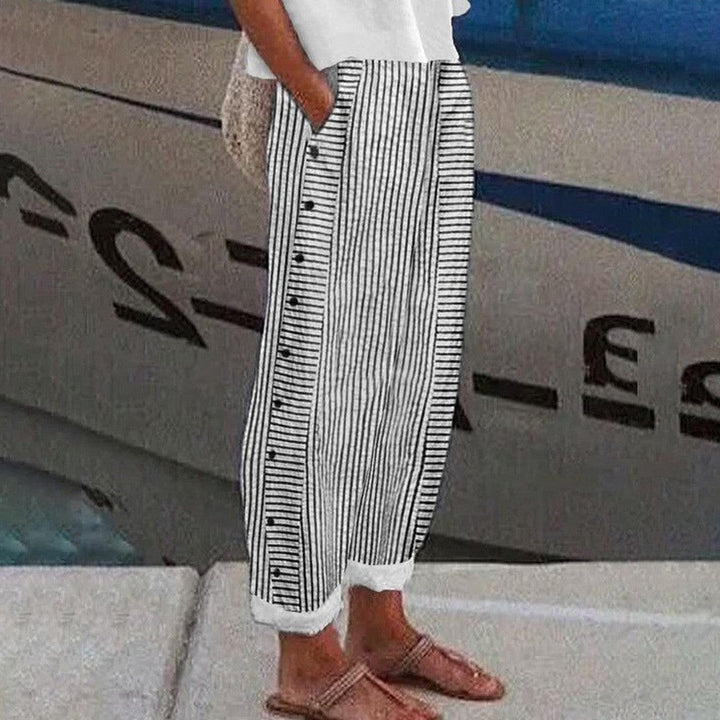 Pantalon Pia femme décontracté à coupe ample avec poches latérales, idéal pour le confort et les loisirs.