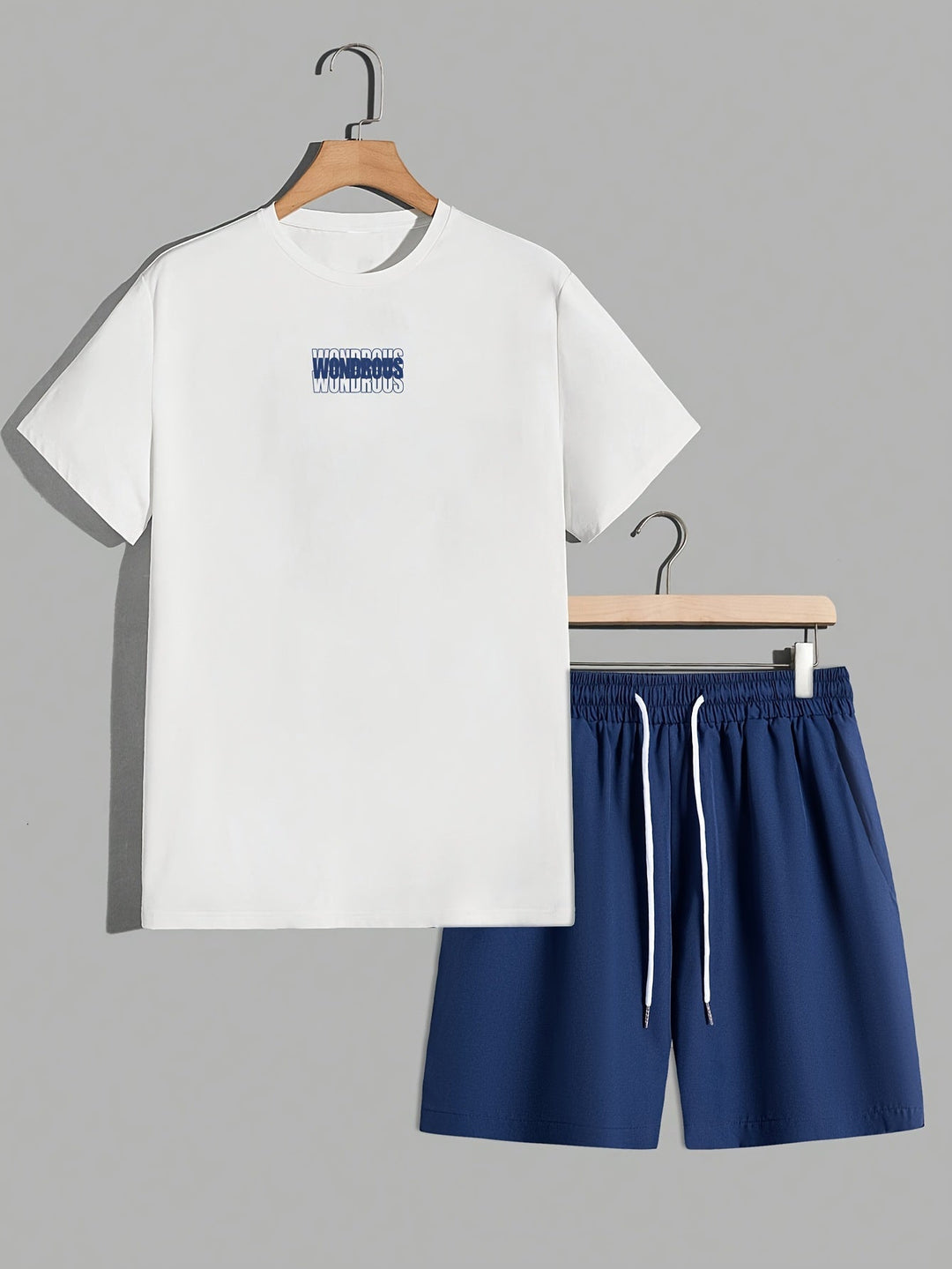 Homme stylé en ensemble streetwear : t-shirt graphique psychédélique et short pour un look urbain moderne.