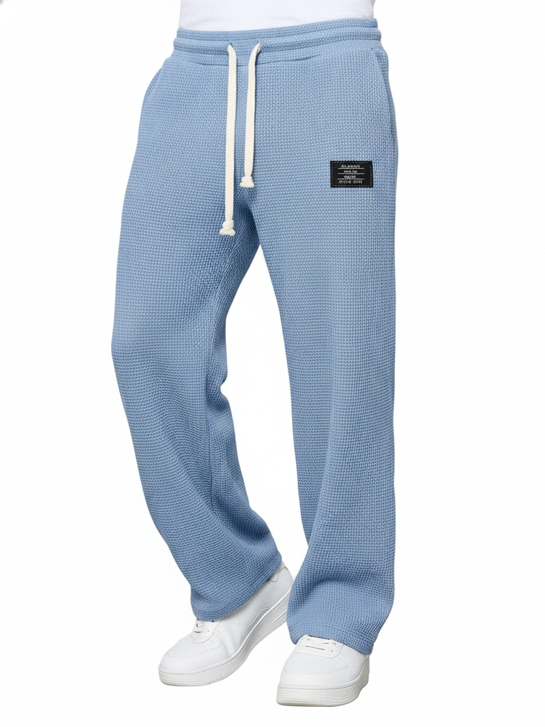 Pantalon jogging homme noir, coupe droite moderne, taille élastique pour un confort streetwear décontracté au quotidien.