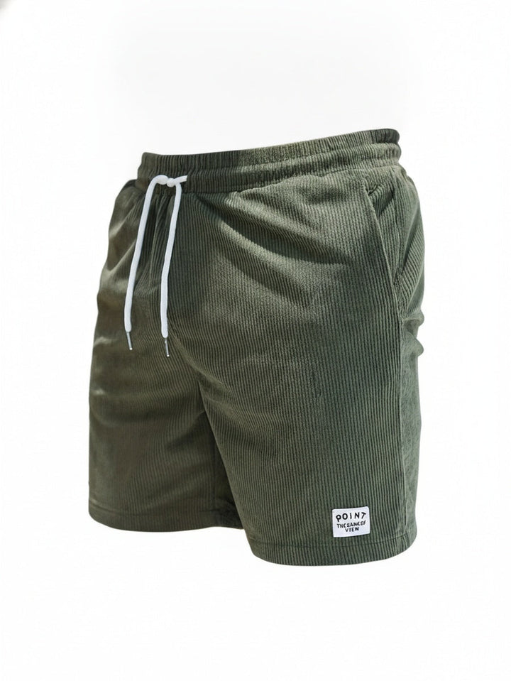 Short de bain homme côtelé bleu marine, style décontracté, idéal pour la plage et l'été.