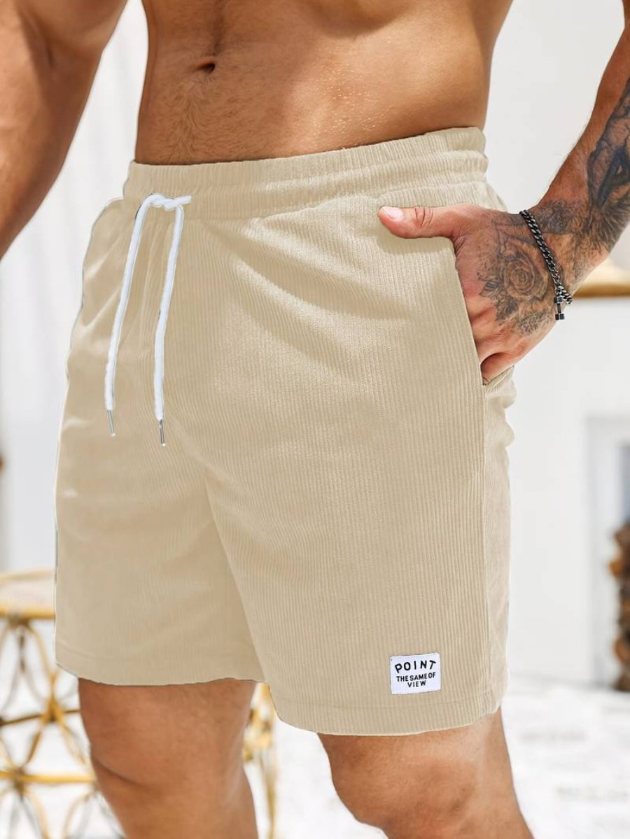 Short de bain homme ajustable, texture côtelée unique, look décontracté chic pour la plage.