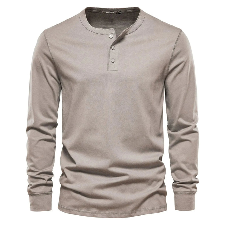T-shirt Henley homme bleu marine, manches longues, parfait pour un look décontracté ou smart-casual.