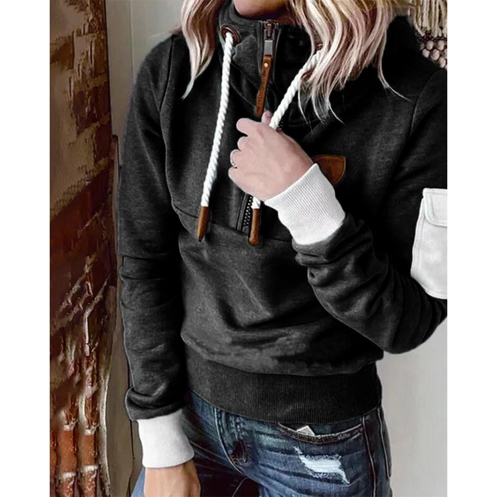 Détail poche kangourou du sweat à capuche femme Aarohi. Vêtement confortable et décontracté, idéal pour l'hiver.