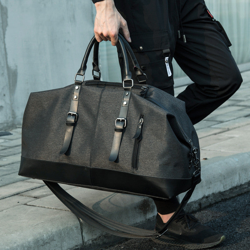 Sac de voyage homme élégant, grande capacité, idéal pour un weekend ou un court séjour.
