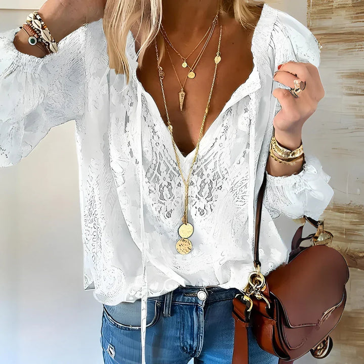 Top femme élégant à manches longues et motifs ajourés délicats, parfait pour le printemps/automne.