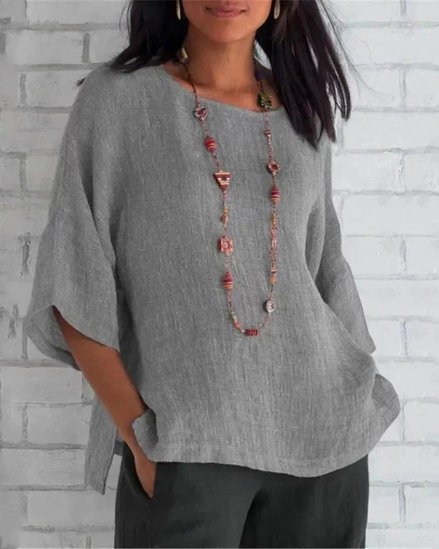 Chemise femme fluide élégante, manches trompette, coupe large. Idéale printemps/été décontracté chic.