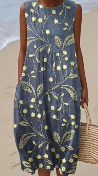 Robe midi fluide femme imprimée, sans manches, style polyvalent. Idéale pour un look élégant et décontracté.