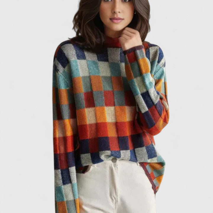 Pull femme décontracté à carreaux multicolores, style moderne et confortable pour toute occasion.