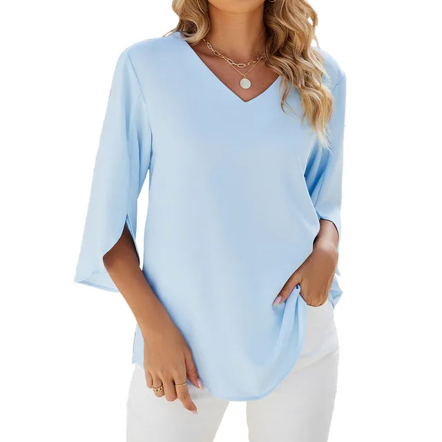 Haut femme élégant col V, manches 3/4, offrant confort léger pour le style quotidien et la mode bureau. Blouse chic.