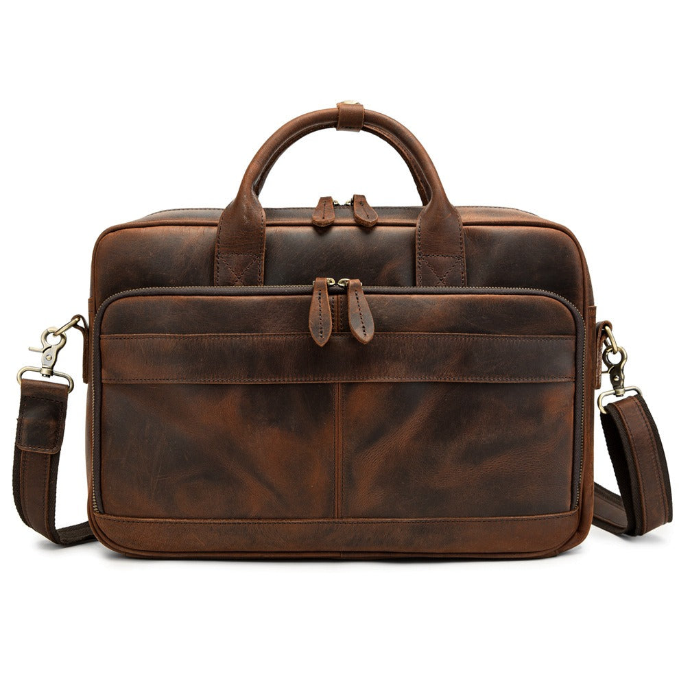 Sac de travail en cuir marron pour homme, sacoche bandoulière pratique pour ordinateur portable. Élégance professionnelle.