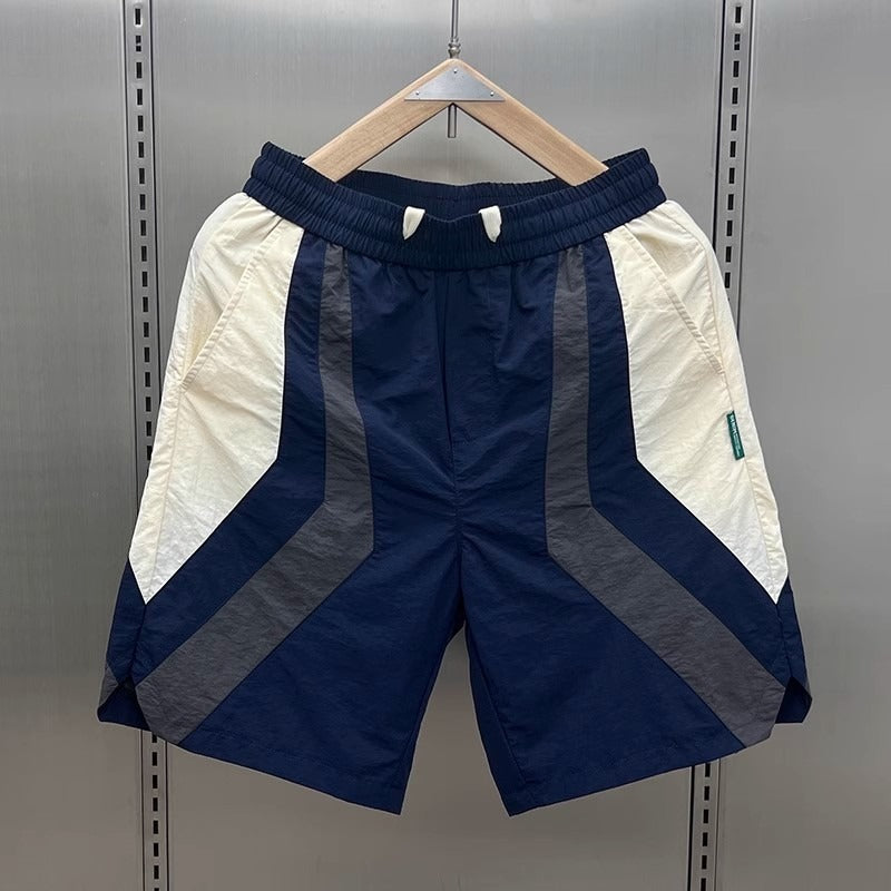Short de sport homme Diego avec design géométrique contrasté. Confort optimal pour l'entraînement.