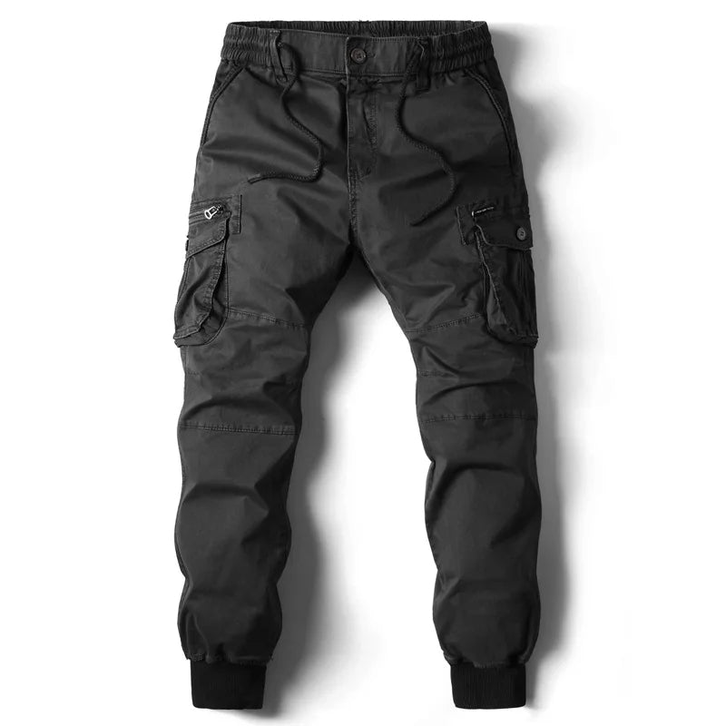 Pantalon jogger cargo homme, coton stretch, taille élastique, chevilles resserrées, look sportif.