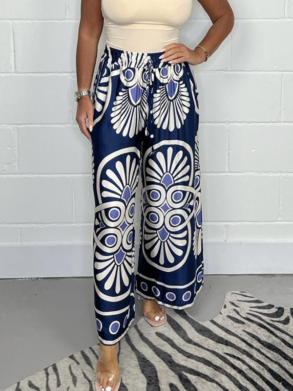 Pantalon fluide imprimé chic pour femmes, offrant tendance et confort, parfait pour une tenue polyvalente et stylée.