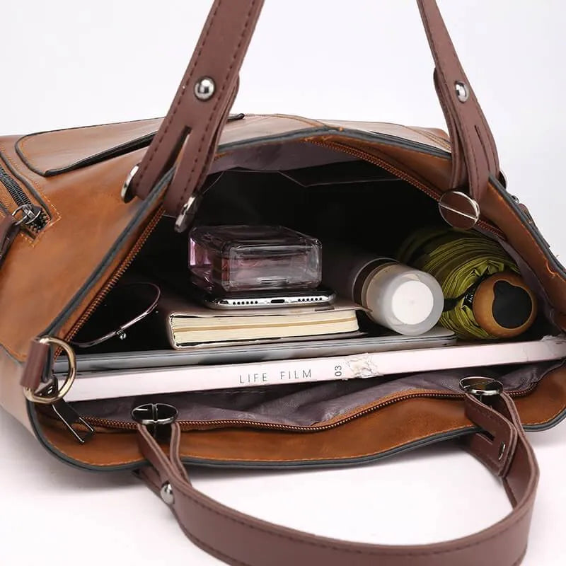 Sac à main bandoulière femme en cuir gris. Accessoire mode élégant et durable pour le quotidien.