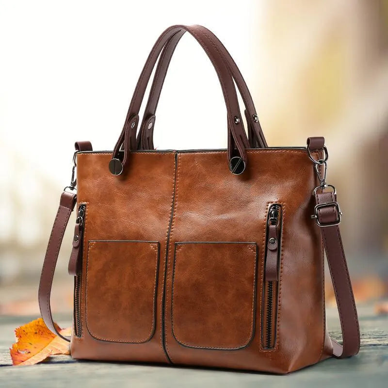 Sac femme en cuir marron, polyvalent et élégant. Bandoulière ajustable, idéal pour le travail ou loisirs.