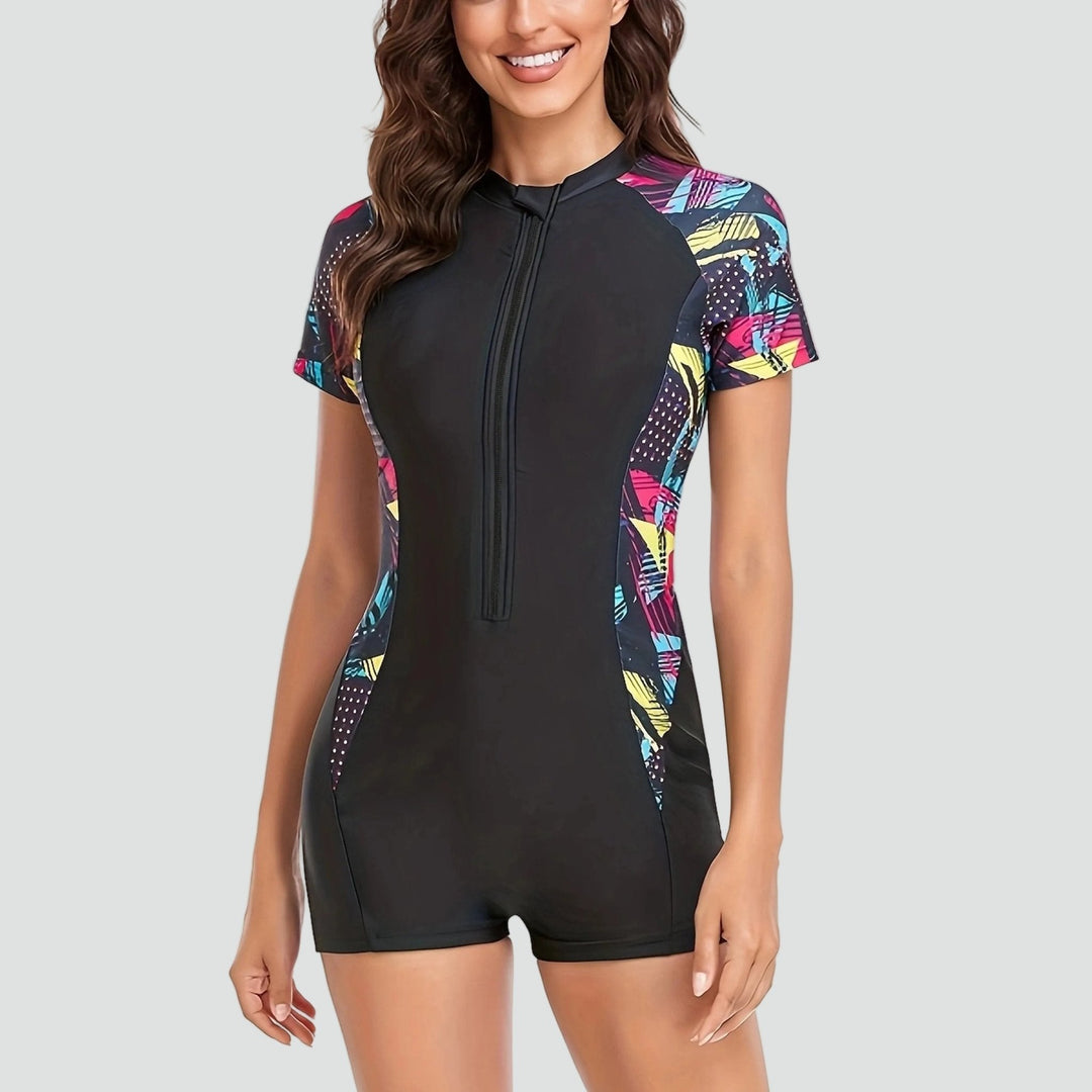 Maillot de bain femme élégant une pièce avec manches courtes et fermeture éclair pour l'été actif.