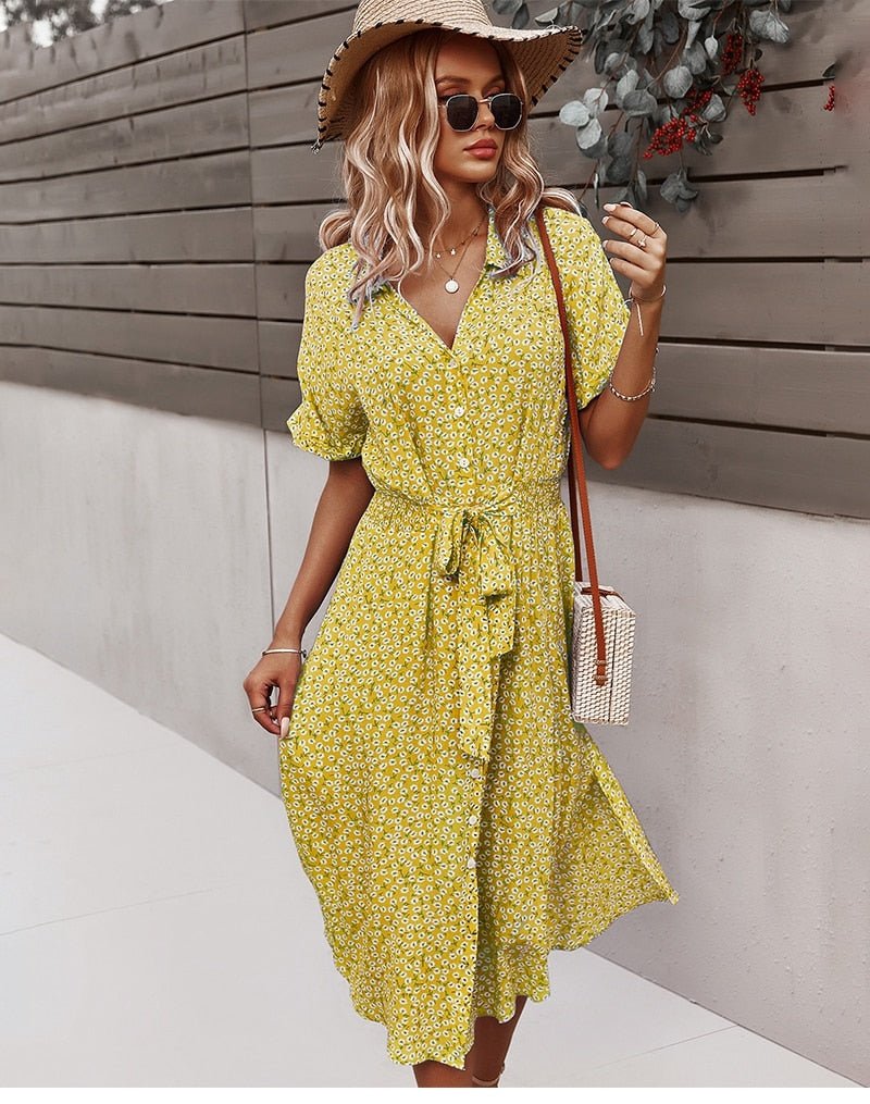 Robe femme Luretta à fleurs, style bohème fluide et ceinturé, pour une élégance naturelle estivale.