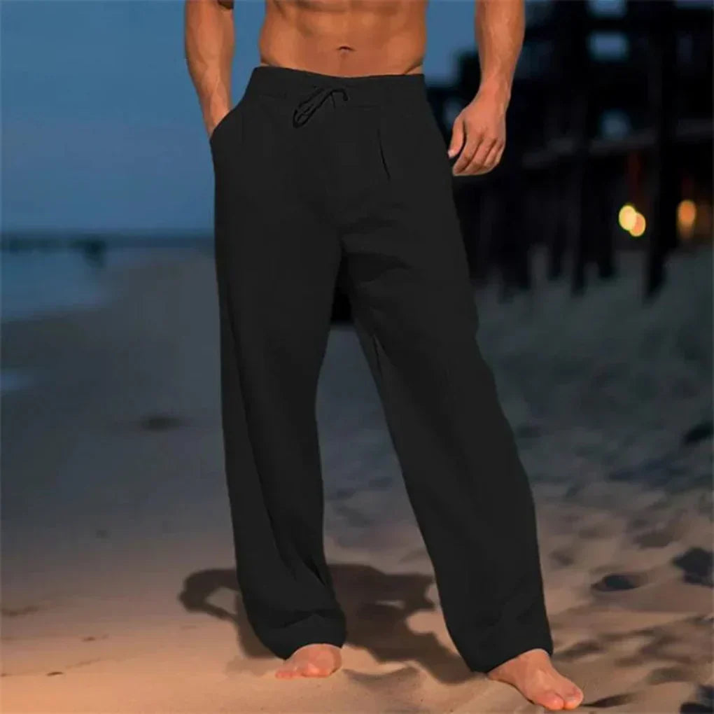 Silhouette d'un homme portant un pantalon fluide à jambes larges, offrant confort et élégance décontractée.