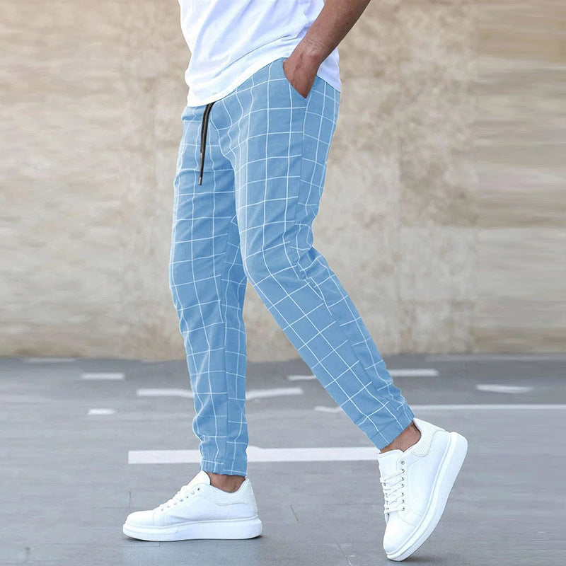 Pantalon de jogging homme à carreaux, style chic et décontracté, idéal pour un look moderne et confortable.