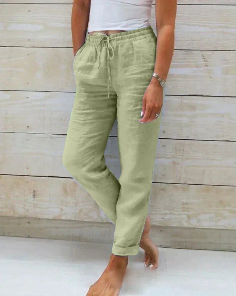 Pantalon femme fluide à taille coulissée, parfait pour le confort décontracté et l'élégance estivale.