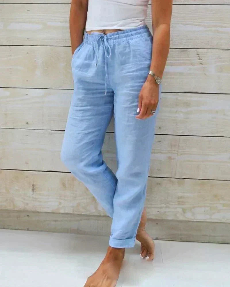 Pantalon fluide femme estival avec taille coulissée, style bohème chic idéal pour la mode été et le confort.