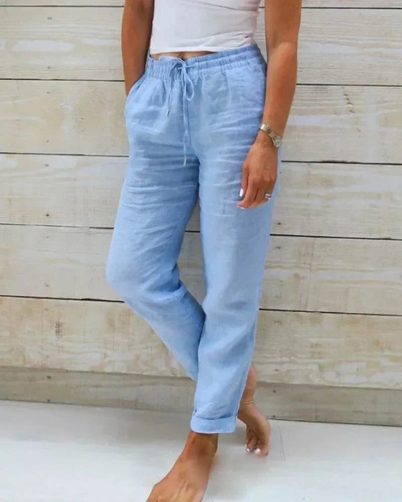 Pantalon femme large en coton et lin, alliant chic et décontracté. Silhouette fluide et élégante.