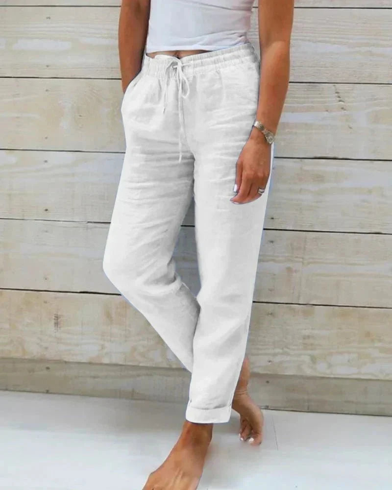 Pantalon femme fluide en coton et lin respirant, idéal pour l'été. Style décontracté et élégant.