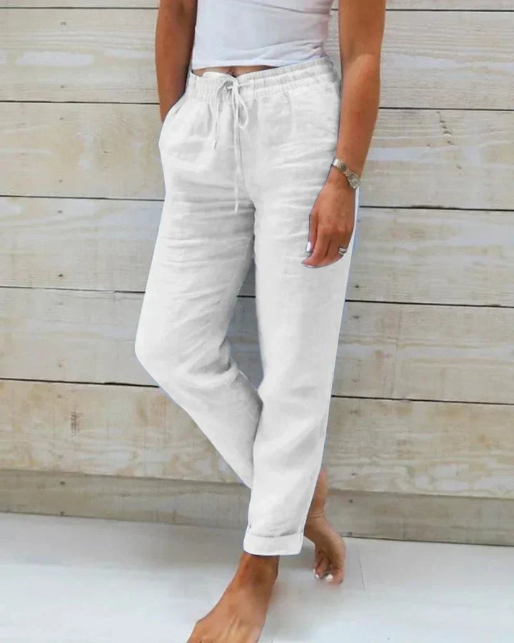 Pantalon femme fluide en coton et lin respirant, idéal pour l'été. Style décontracté et élégant.