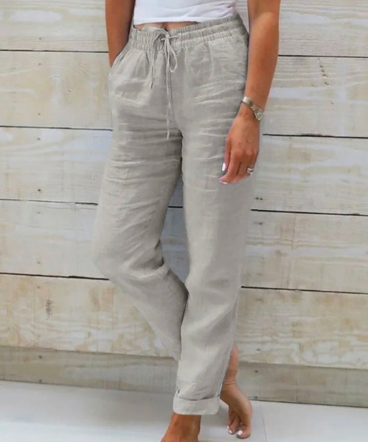 Pantalon large femme taille élastique en coton et lin, coupe fluide. Idéal pour un look décontracté d'été.