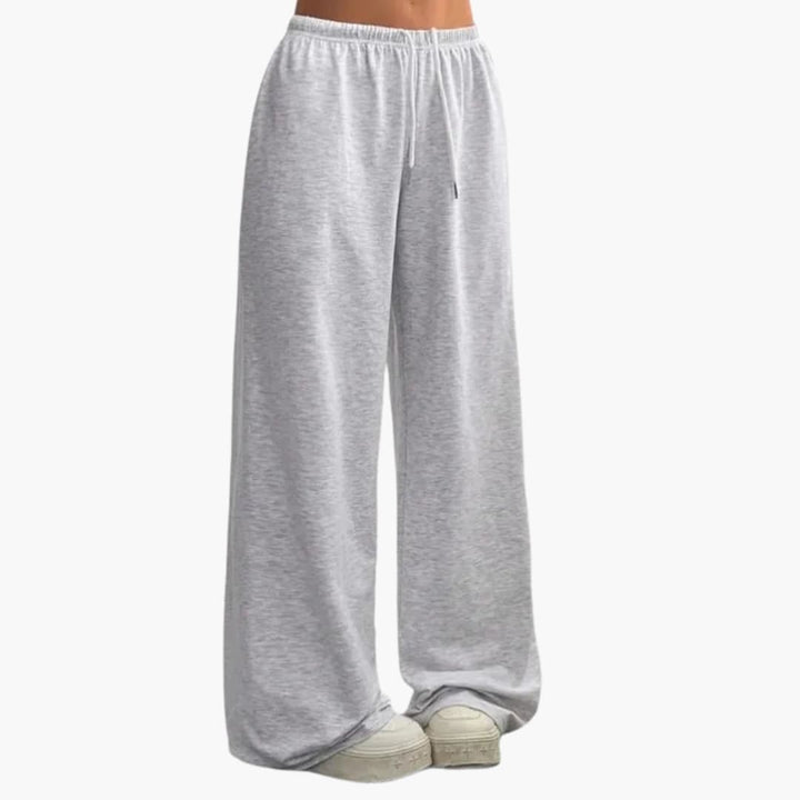Pantalon droit large femme, taille élastique, parfait pour un look moderne et confortable. Vêtement décontracté chic.