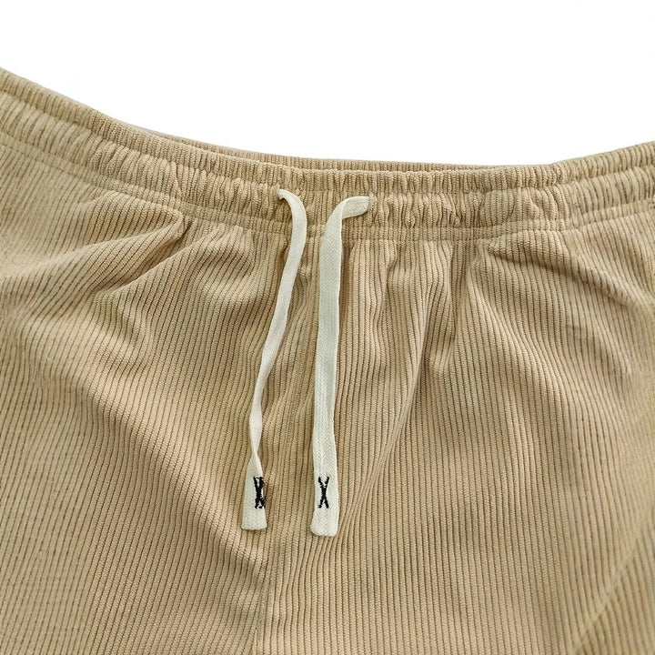 Pantalon femme velours côtelé extensible, avec cordon de serrage, pour un confort optimal.