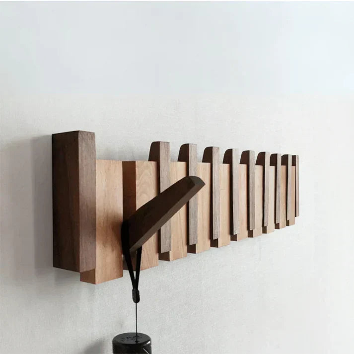 Porte-manteau mural compact en bois, design piano, optimise l'espace de votre entrée avec style.