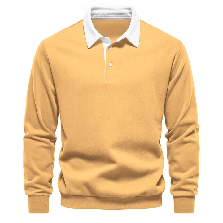 Polo rugby homme chic, manches longues, col contrastant, style sportif masculin. Idéal pour automne/hiver.