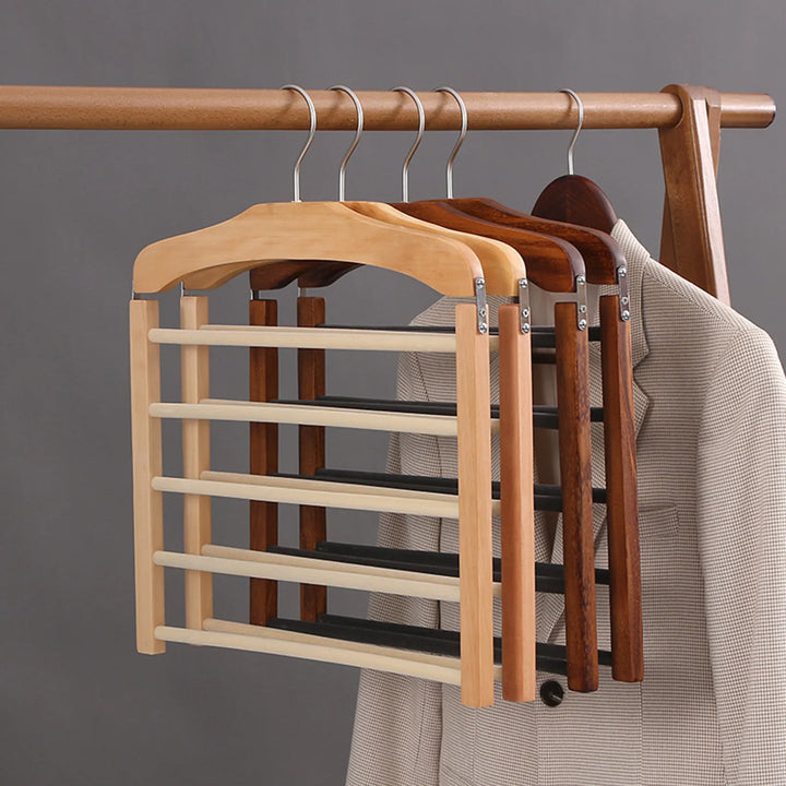 Portant à pantalons en noyer massif, idéal pour rangement penderie. Gain de place et antifroissement pour vos vêtements.