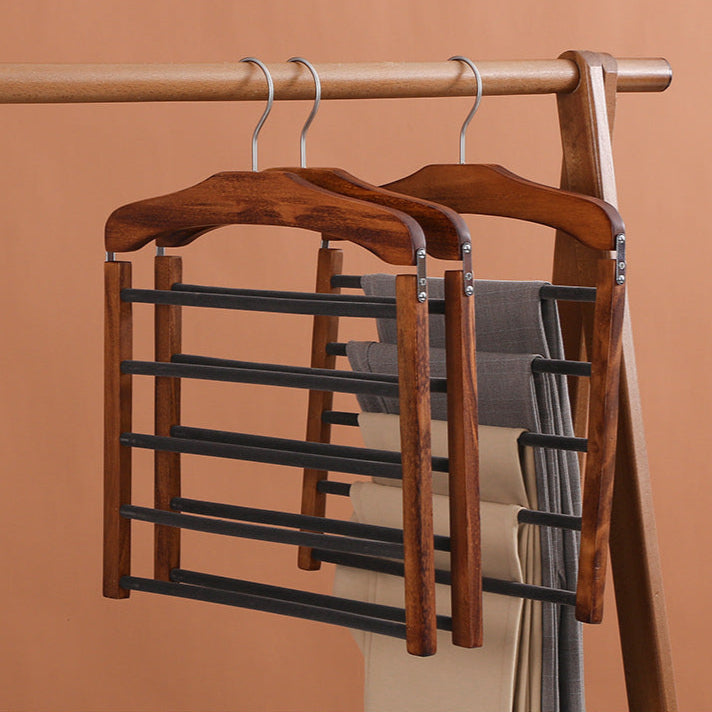 Décoration intérieure et fonctionnel : portant à pantalons en noyer massif. Un organisateur vêtements élégant et pratique.