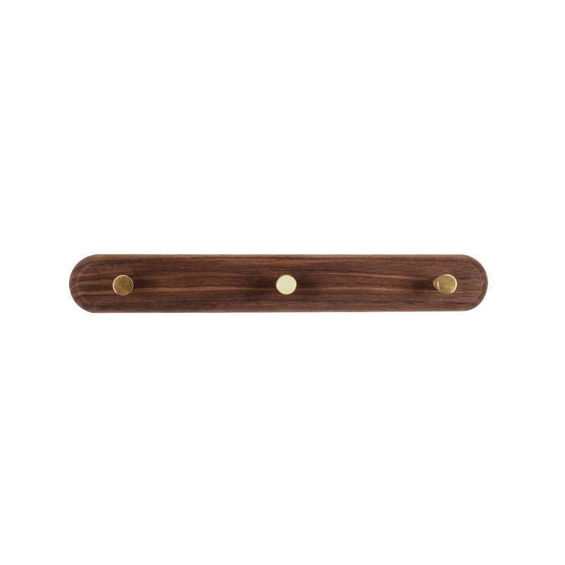 Porte-manteau en bois et laiton, fixation murale pour un gain de place élégant dans l'entrée.