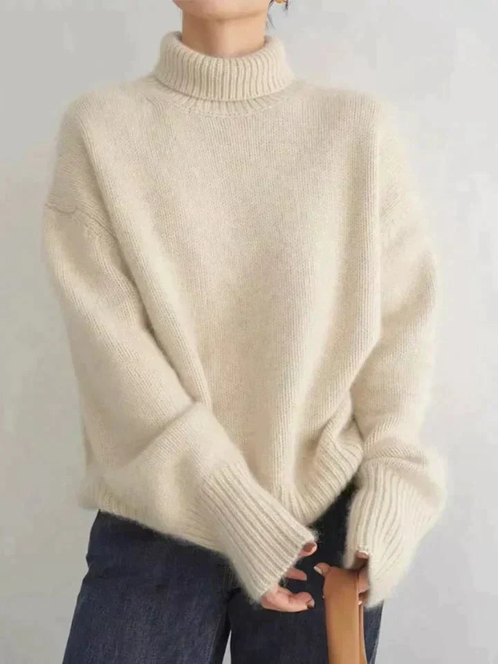 Pull à col roulé femme, pièce élégante et intemporelle. Apporte chaleur douce et style raffiné à toute garde-robe.