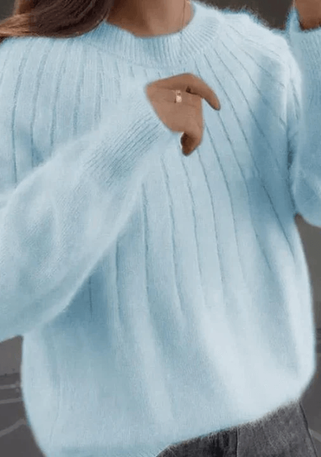 Vêtement chaud et doux pour femme, ce pull assure confort et style pour toutes les occasions hivernales.
