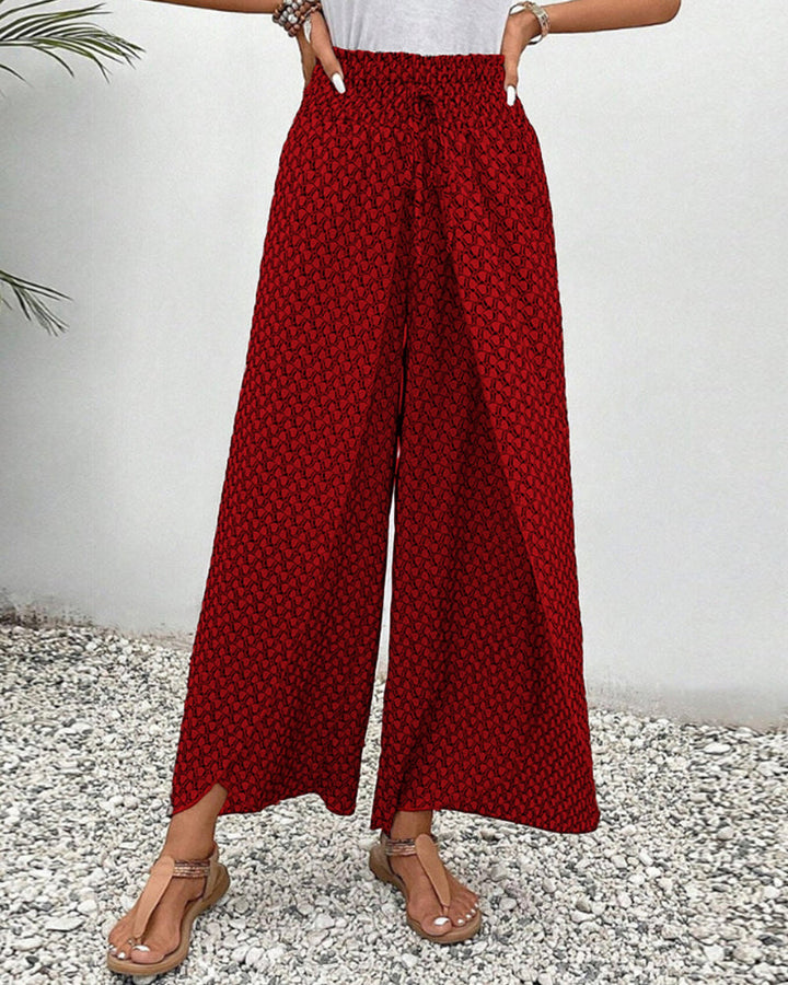 Pantalon femme à taille haute flatteuse et jambes larges fluides, tendance moderne.
