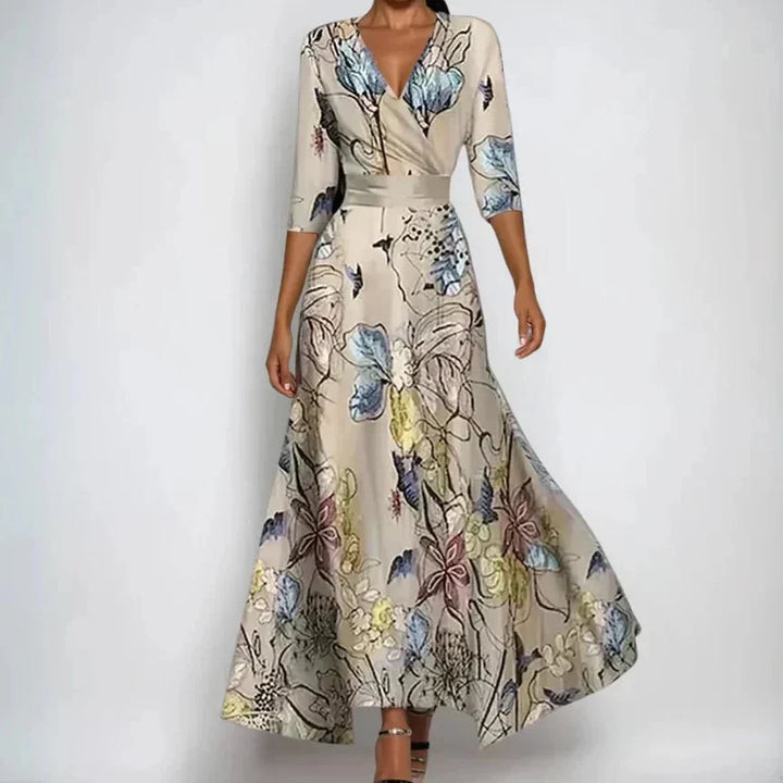 Robe midi femme confortable à fleurs, col en V et manches trois-quarts. Parfaite pour le printemps/été.